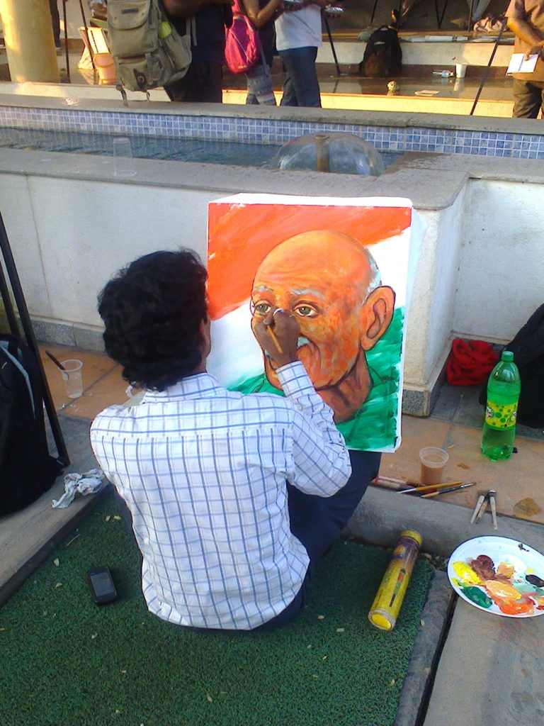 Gandhi being painted